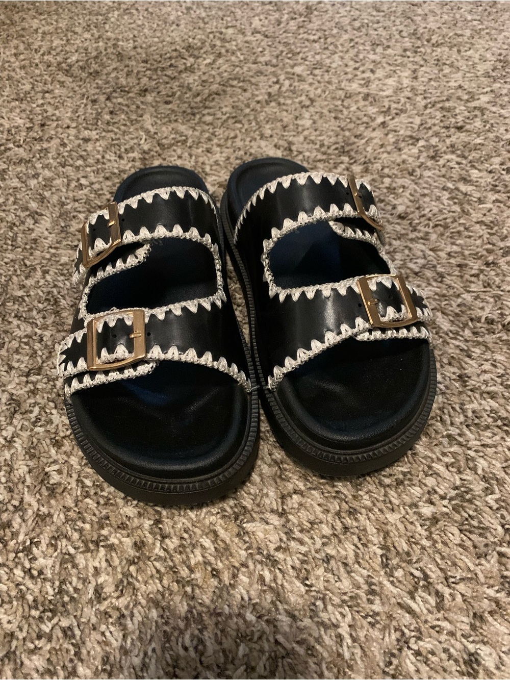 Black Slide Sandals with White Trim and Gold Buckles